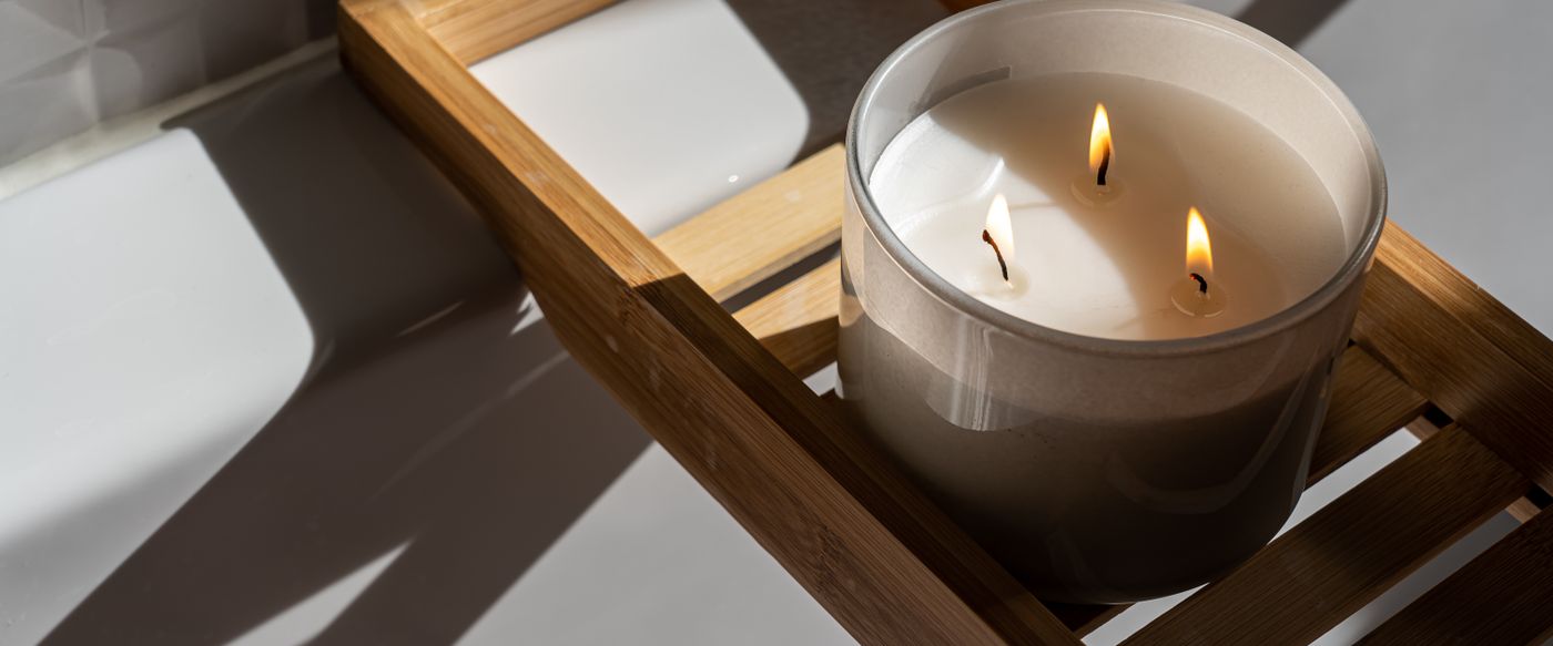 A jar candle burning clean after a quick candle wick trimmer pass